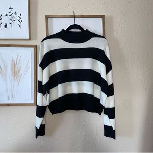 Cropped mock neck sweater.